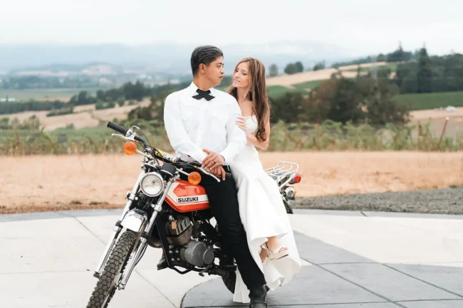 Bride and groom on a motorcycle