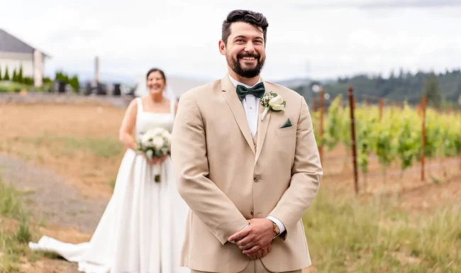 Bride and groom first look in the vineyard