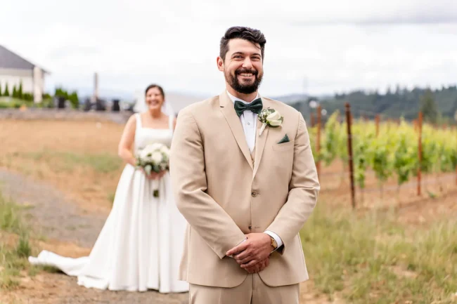 Bride and groom first look in the vineyard